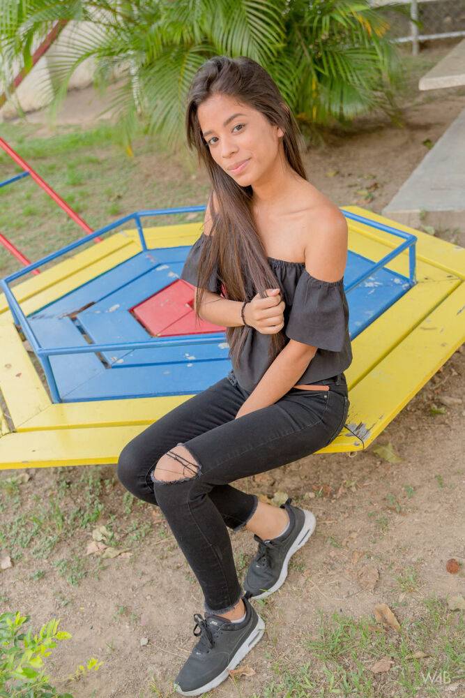 Smiley hot glamour girl Karin Torres looking sexy in ripped jeans on a swing - #2