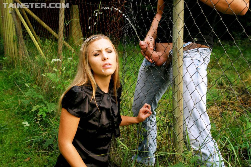 Clothed girl gets peed on after sucking off a cock thru a wire fence - #10