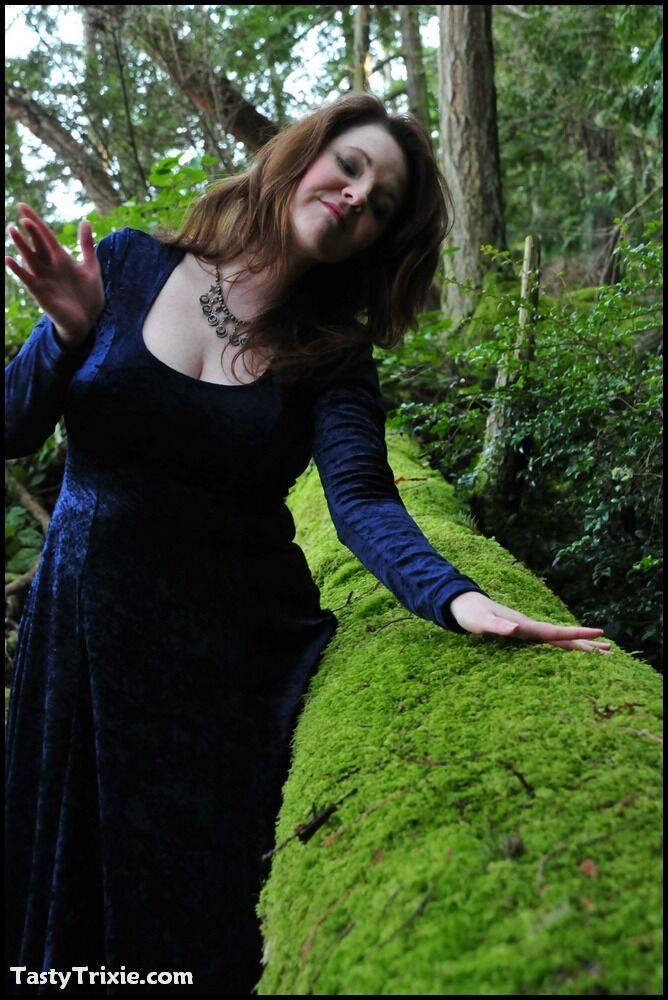 Mature woman Tasty Trixie heads into the woods to flash in a long velvet dress - #4