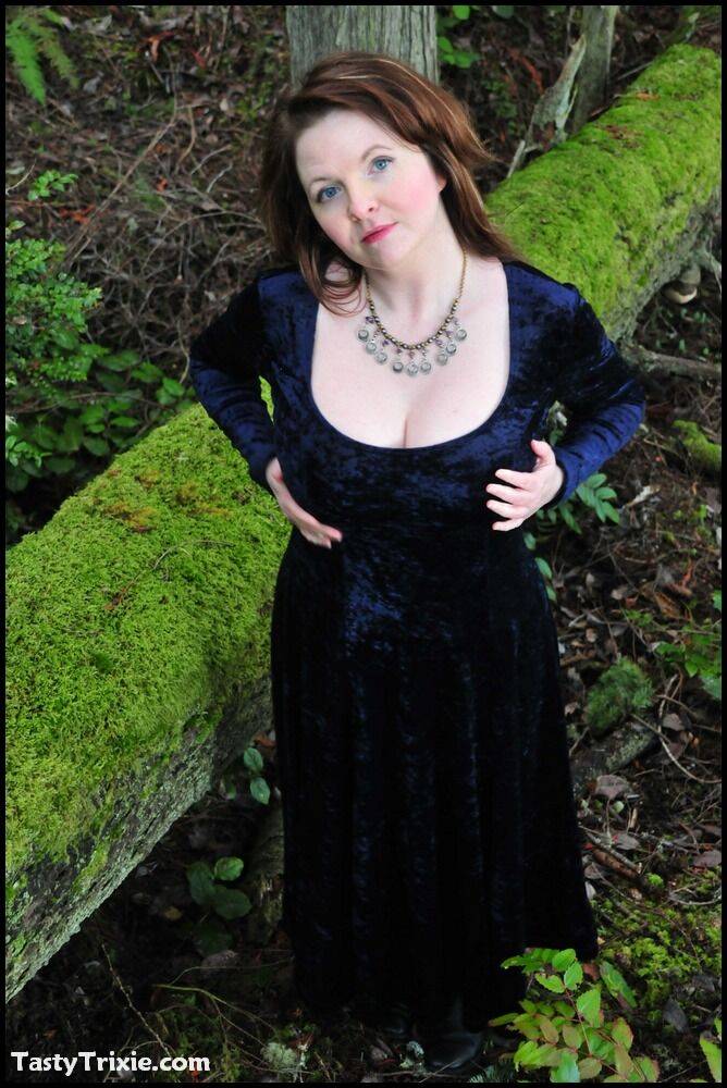 Mature woman Tasty Trixie heads into the woods to flash in a long velvet dress - #15