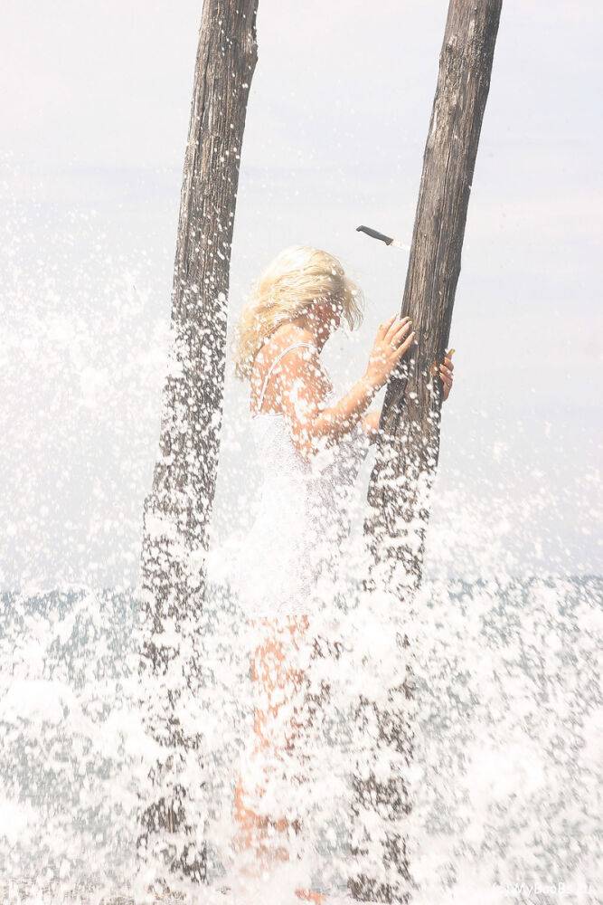 Big titted blonde Ines Cudna gets soaked as a wave breaks over her by the sea - #14