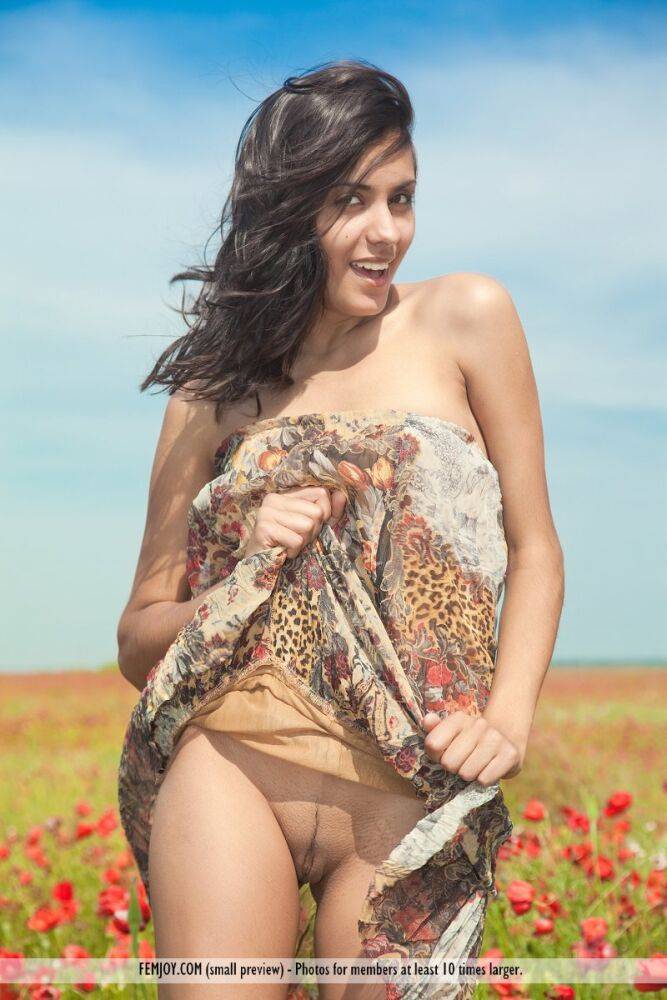 Long legged brunette Adrienne models totally naked a field of wildflowers - #8