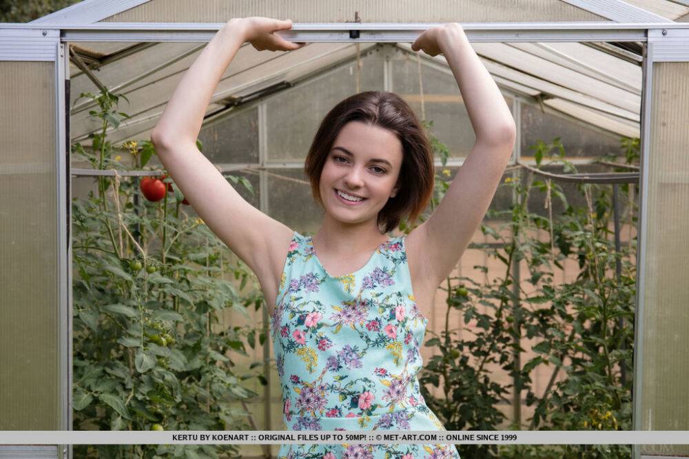 Sweet teen Kertu showcases her bald pussy after getting naked in a greenhouse - #8