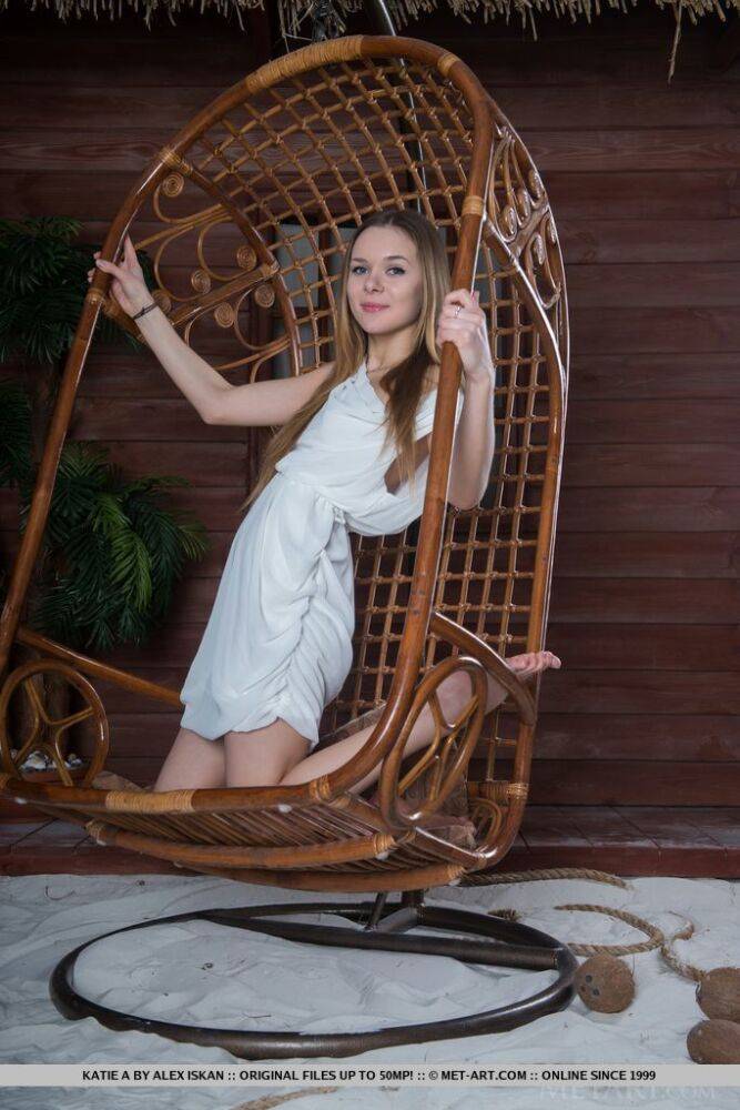 Long haired teen Katie A gets totally naked in a hanging basket chair - #8