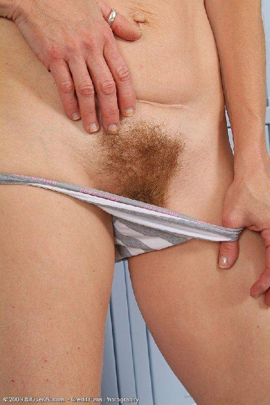 Cute mom stripping in a locker room and reveals her hairy bush from panties - #7