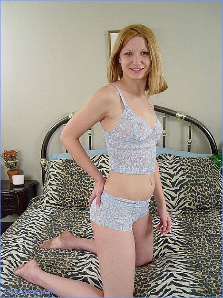 Young redhead removes a lingerie ensemble before toying her bald twat on a bed - #14