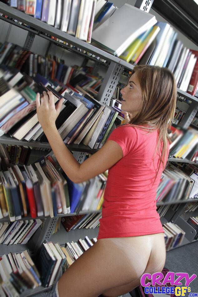 Big ass brunette babe Emma getting naked and flashing in a library - #7