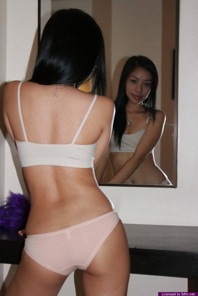 Pretty Asian teen Kim casually showcases her tight slit on a table - #11