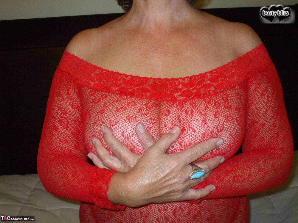 Older amateur Busty Bliss models on her bed in see thru lingerie - #8