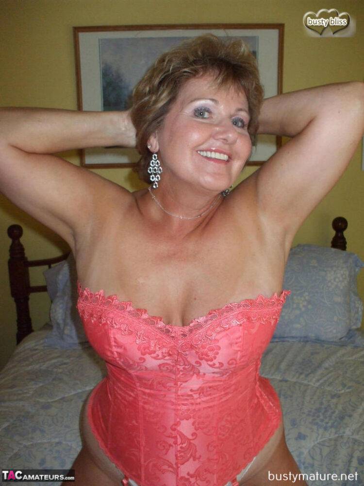 Older lady Busty Bliss frees her natural boobs from pink waist cincher - #7