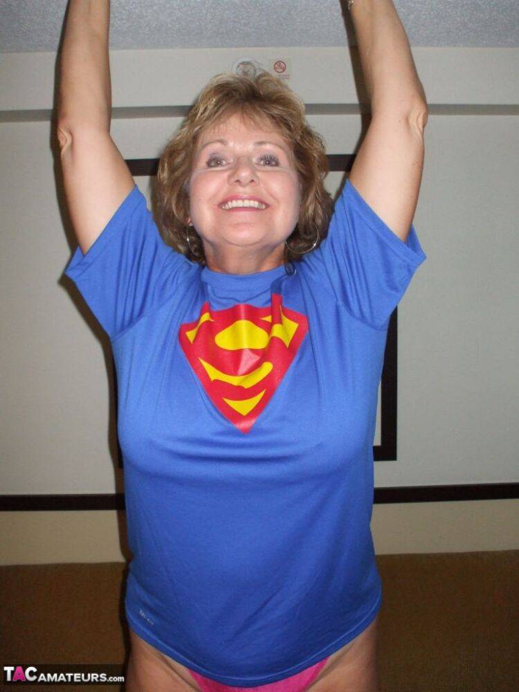 Older amateur Busty Bliss looses her big tits from a Superman T-shirt - #2