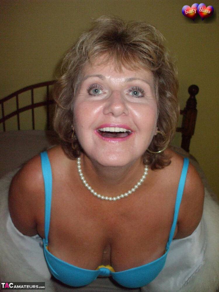 Mature amateur Busty Bliss frees her tan lined tits from a bra and fur coat - #9