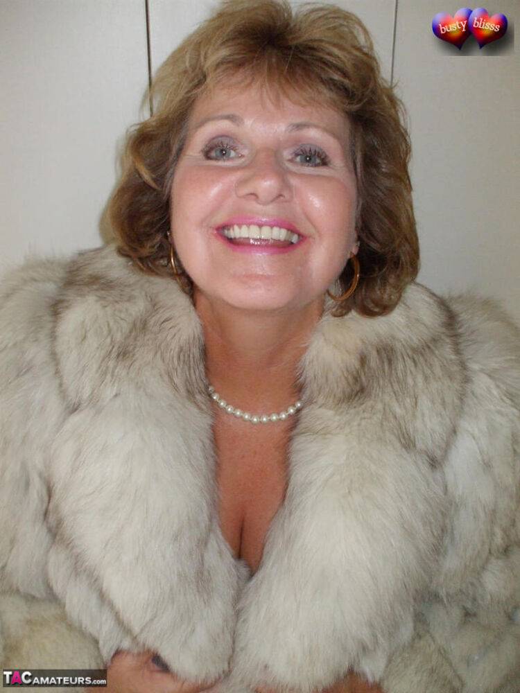 Mature amateur Busty Bliss frees her tan lined tits from a bra and fur coat - #14