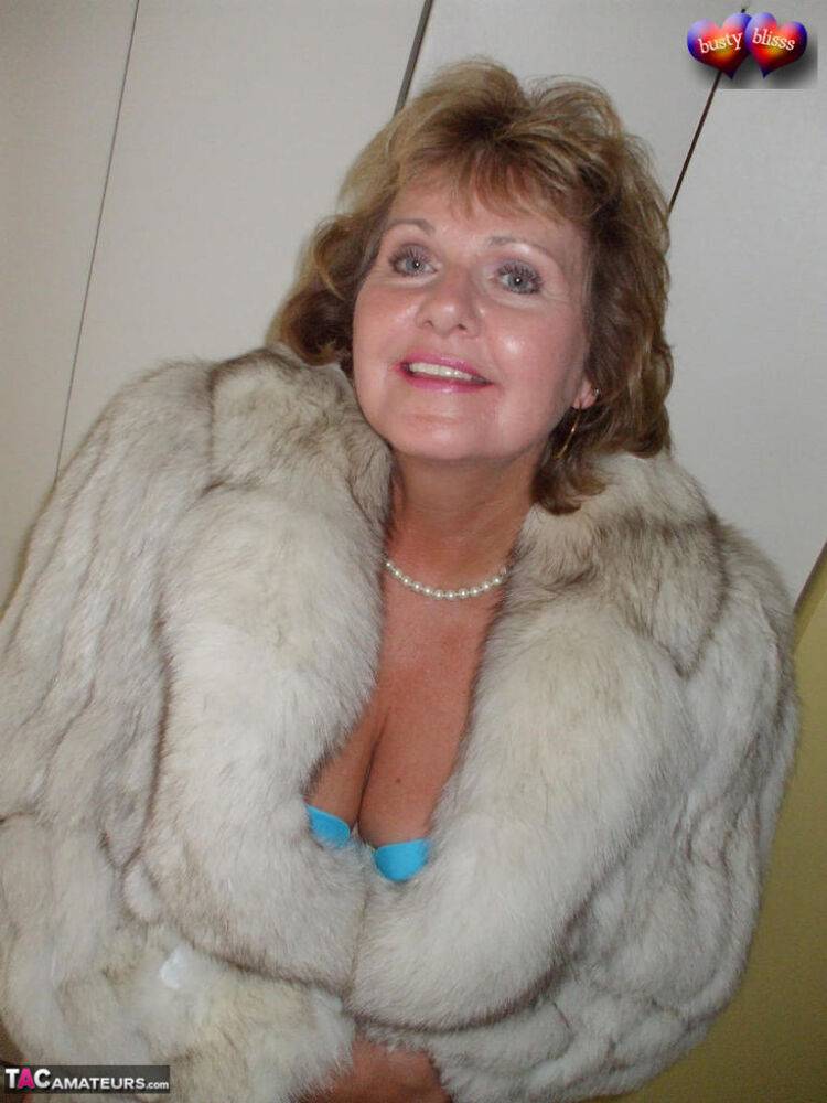 Mature amateur Busty Bliss frees her tan lined tits from a bra and fur coat - #7