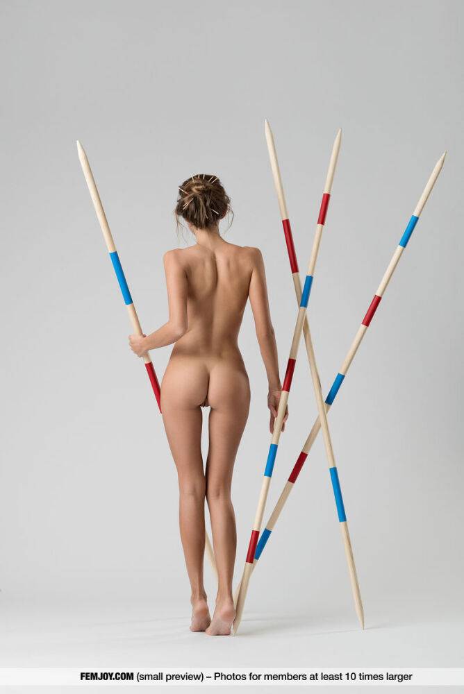 Caucasian solo girl Clover models totally naked amid javelins - #14