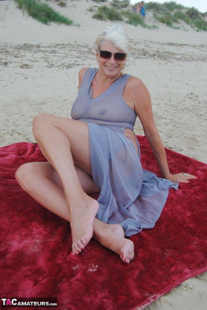 Mature platinum blonde Dimonty models at the beach in see through clothing - #5