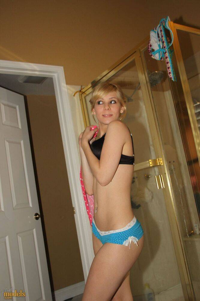 Cute blonde Emma touts her sexy ass before getting in a bathtub - #16