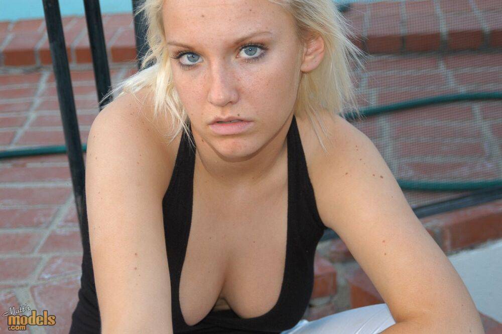 Blonde amateur Jordan smokes a cigarette while showing some cleavage - #9