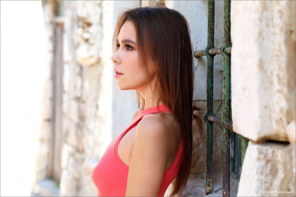 Long legged redhead models a short dress and heels in an alleyway - #2