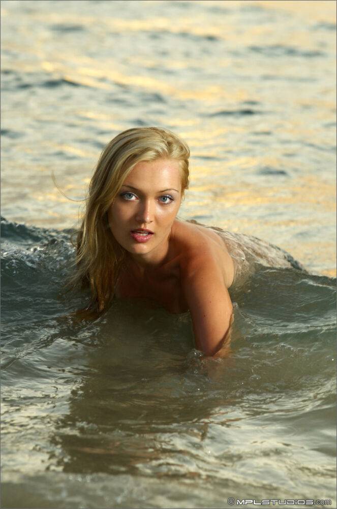 Beautiful blonde models totally naked on a beach before getting in the ocean - #7