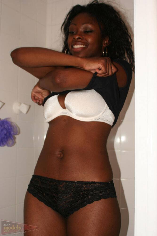 Black amateur Deja uncovers her perky boobs as she disrobes in a shower stall - #10