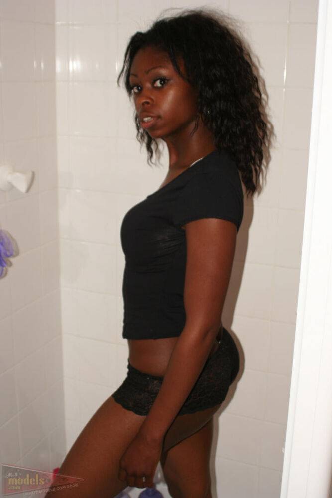 Black amateur Deja uncovers her perky boobs as she disrobes in a shower stall - #12