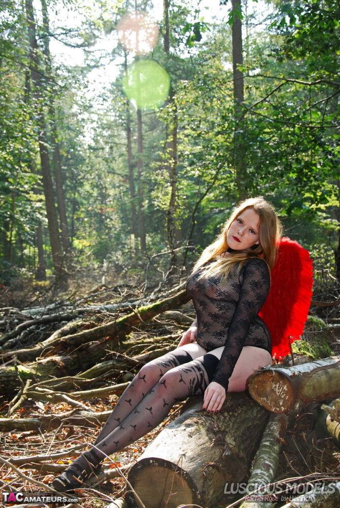 Amateur model poses in lingerie and stockings with angel wings in the woods - #10