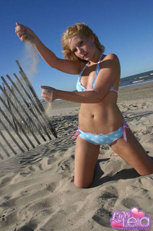 Teen amateur models a bikini on a beach during a non nude solo shoot - #5