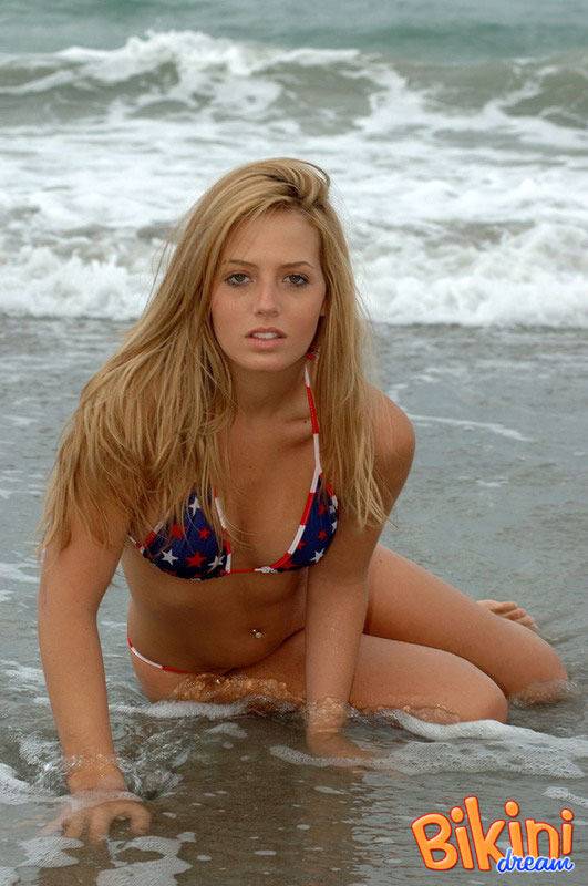 Blonde girl Shannon models in the surf wearing a bikini and a smile - #14