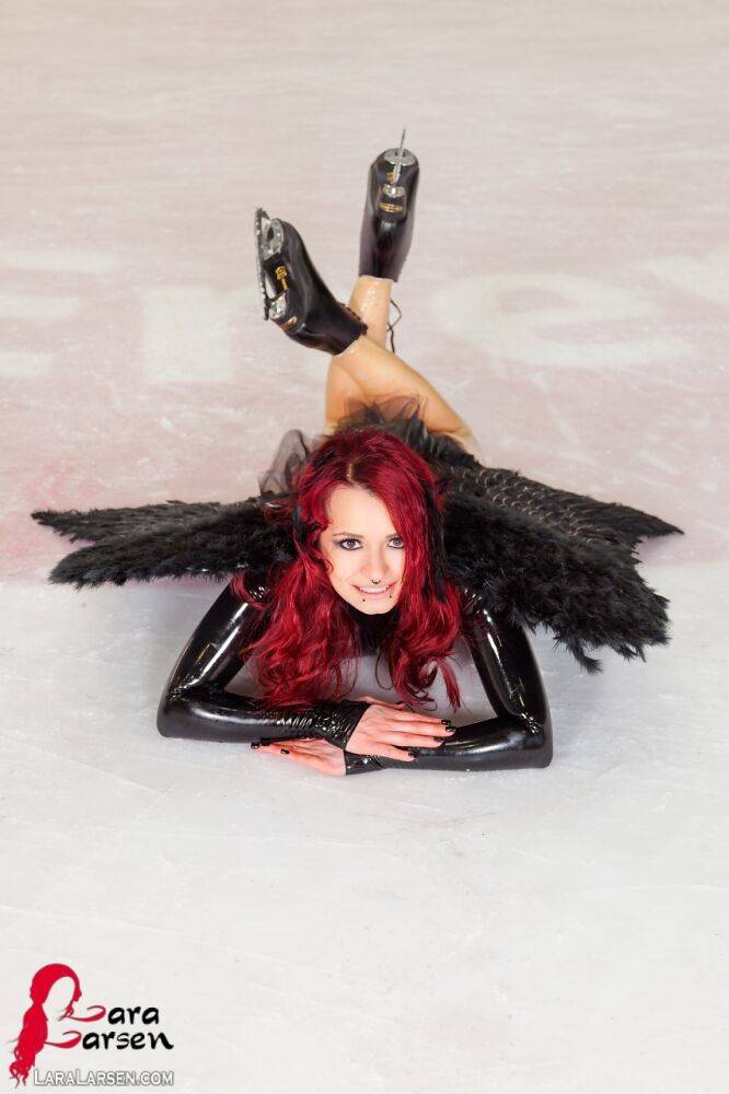 Redhead amateur Lara Larsen models non nude in latex attire with wings - #4