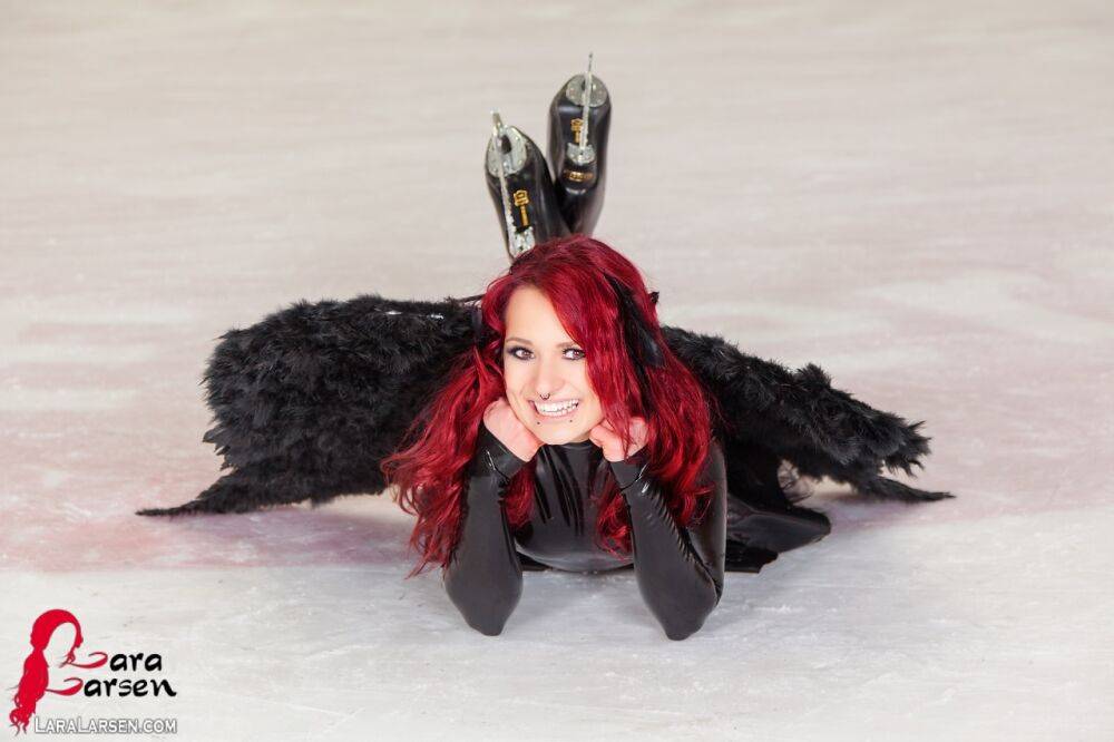 Redhead amateur Lara Larsen models non nude in latex attire with wings - #9