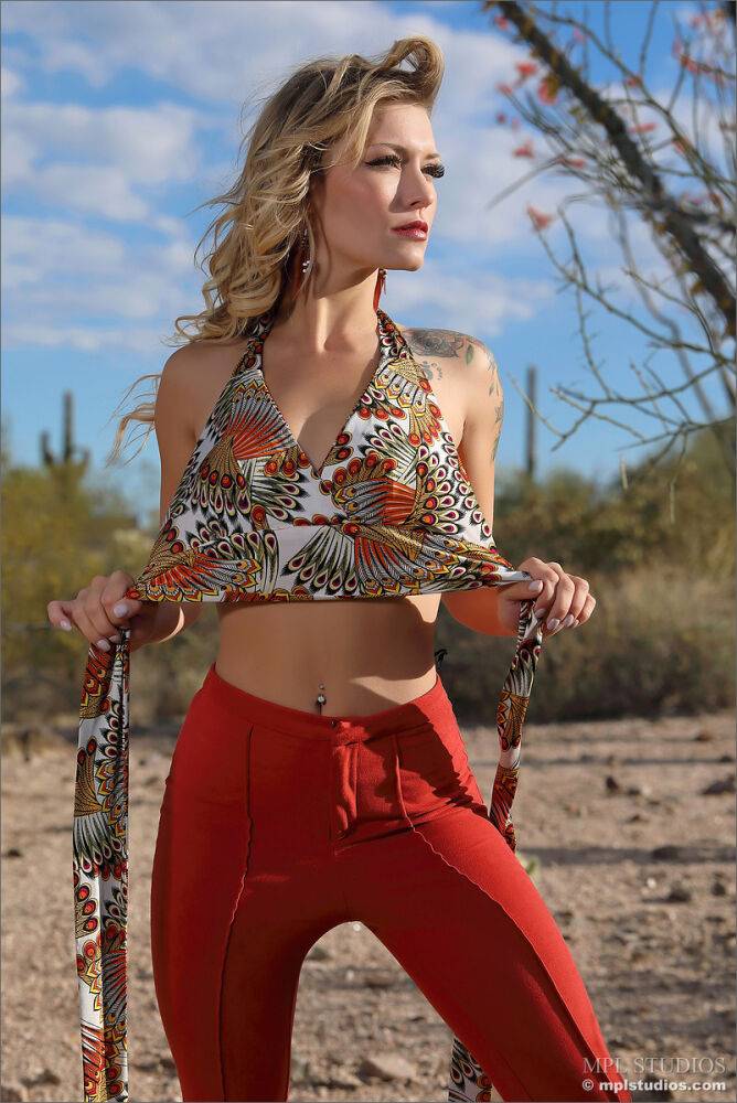 Beautiful blonde models naked in a desert setting while wearing heels - #12