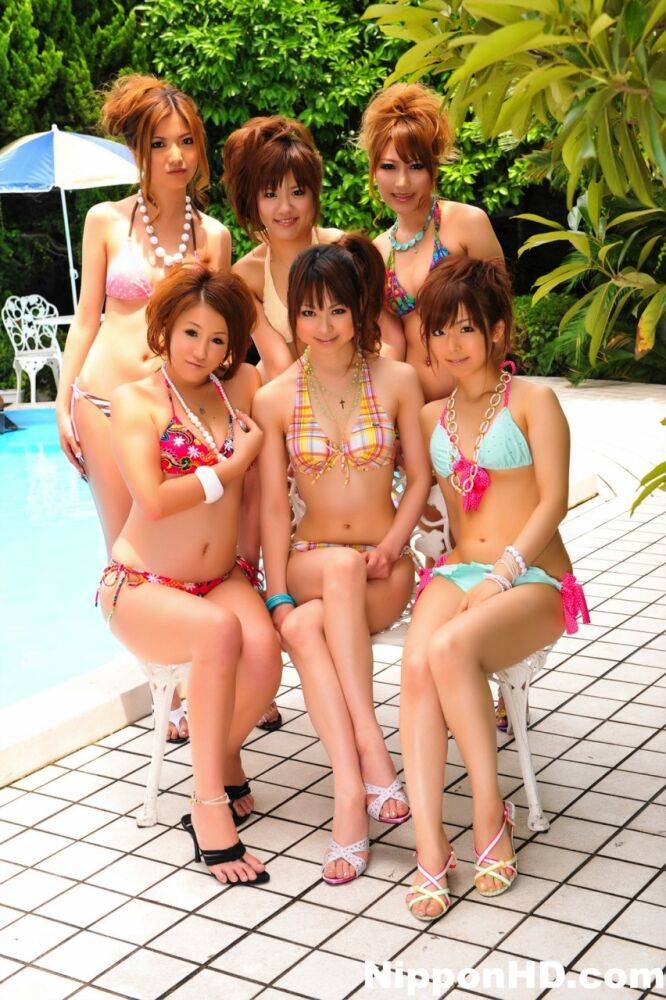 Japanese bikini models gather on a poolside patio for a group shoot - #3