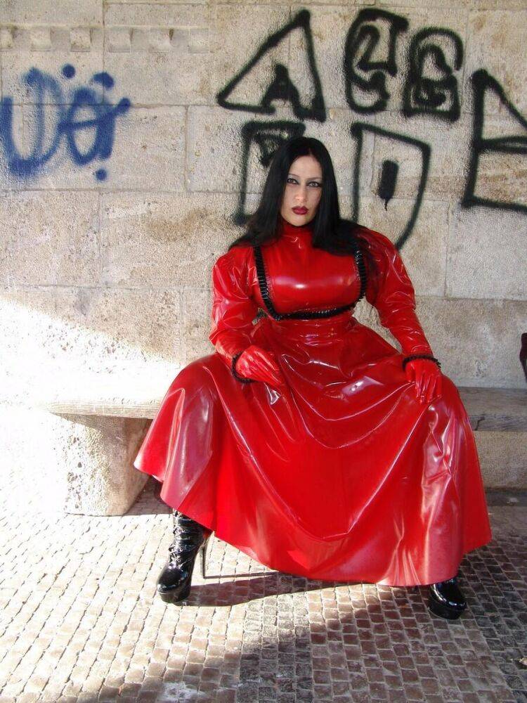 Goth woman Lady Angelina models a red latex dress during non-nude action - #3