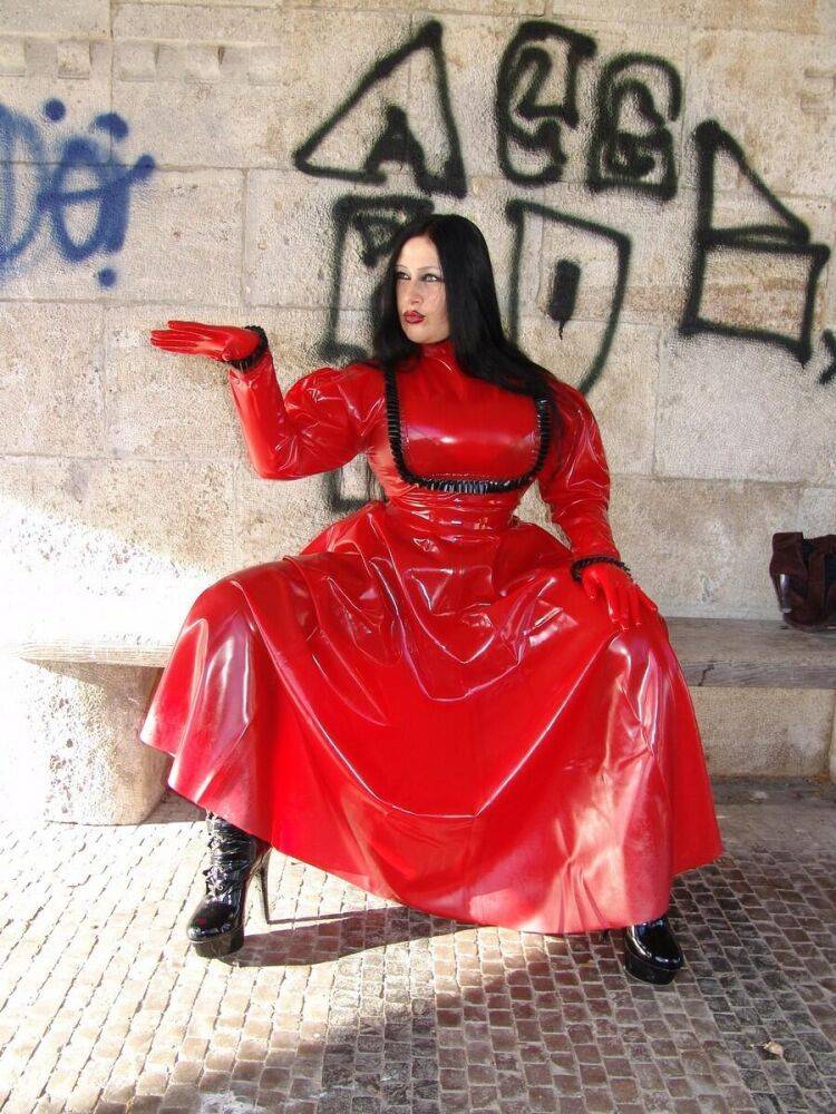 Goth woman Lady Angelina models a red latex dress during non-nude action - #8