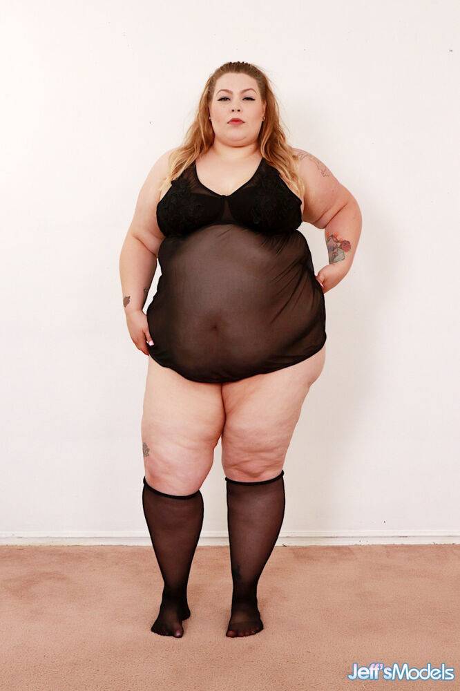 Super-sized BBW Baby Doll gets naked on a futon in knee-high nylons - #11