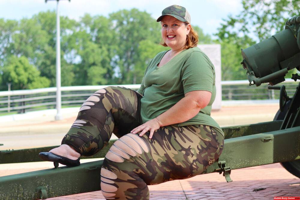 Obese amateur Goddess Pear models for a SFW shoot on an artillery gun in camo - #5