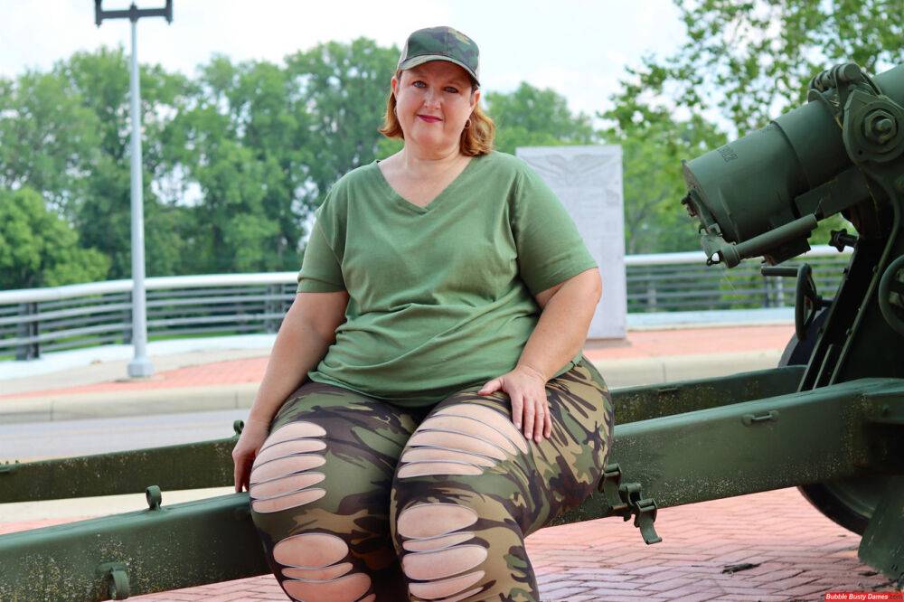 Obese amateur Goddess Pear models for a SFW shoot on an artillery gun in camo - #8