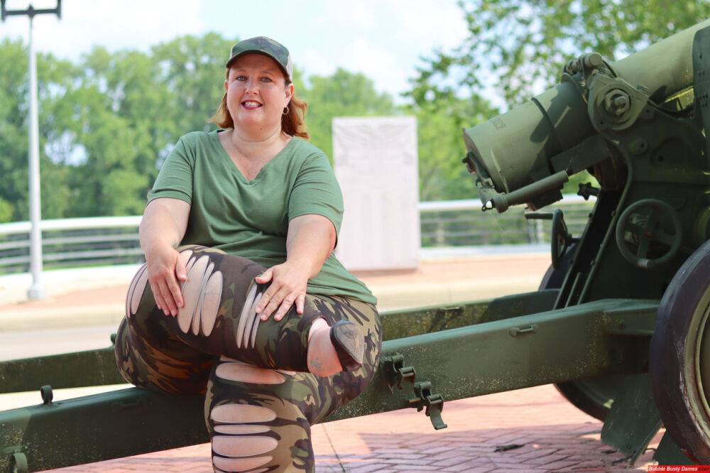 Obese amateur Goddess Pear models for a SFW shoot on an artillery gun in camo - #7