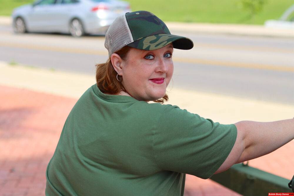 Obese amateur Goddess Pear models for a SFW shoot on an artillery gun in camo - #2