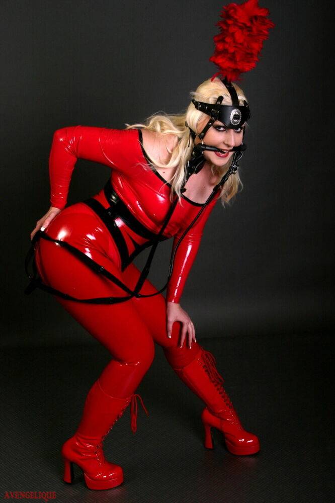 Blonde female models a red latex ponygirl outfit during a non-nude session - #15