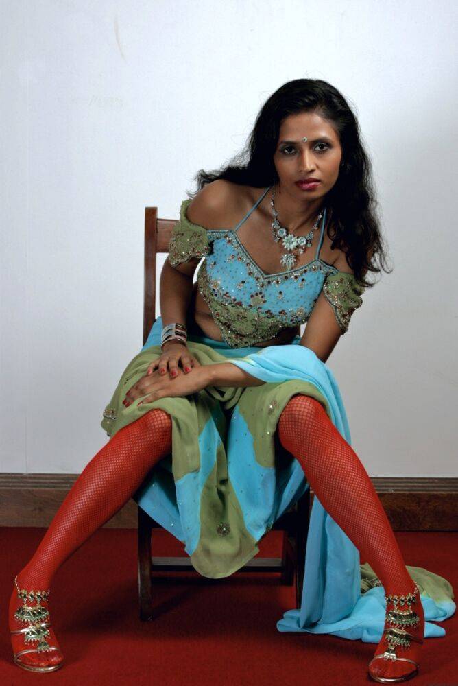 Indian woman models in a strapless bra and panties paired with red hosiery - #11