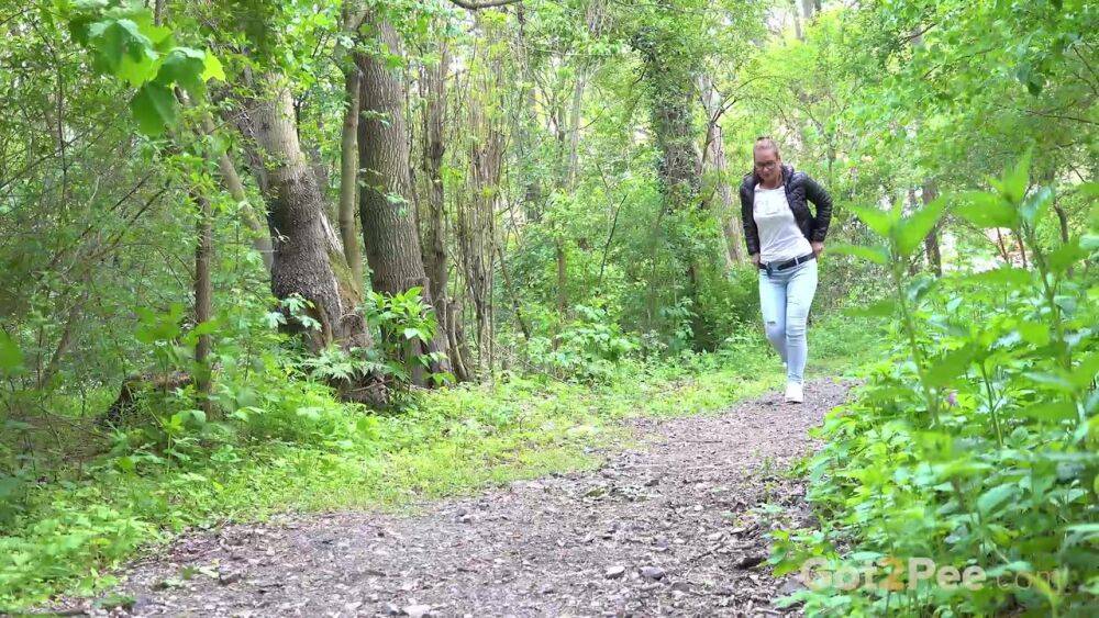 Solo girl Naomi Bennet pulls down her jeans for a piss on a path in the woods - #10