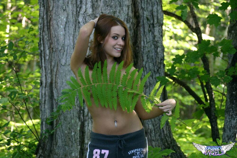 Amateur girl Serena strips to black panties during a walk in the woods - #7