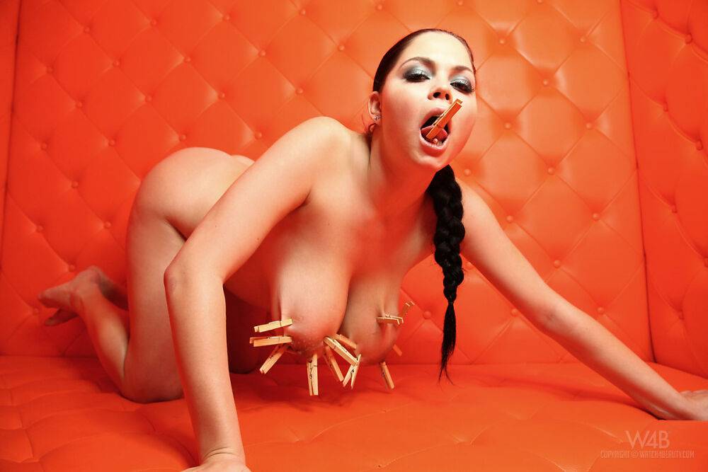 Naked female Shione affixes clothes pegs to her hooters and tongue | Photo: 2895776