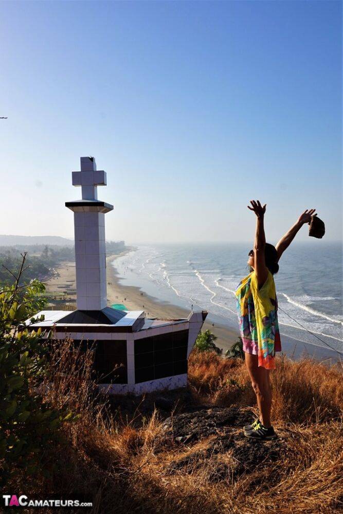 Older lady Diana Ananta exposes herself during a hike to a shrine atop a cliff - #12