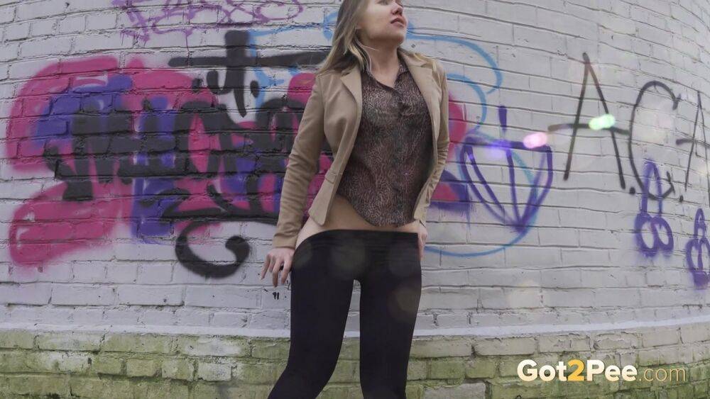 White girl Diana takes a badly needed piss behind a bricked structure - #3