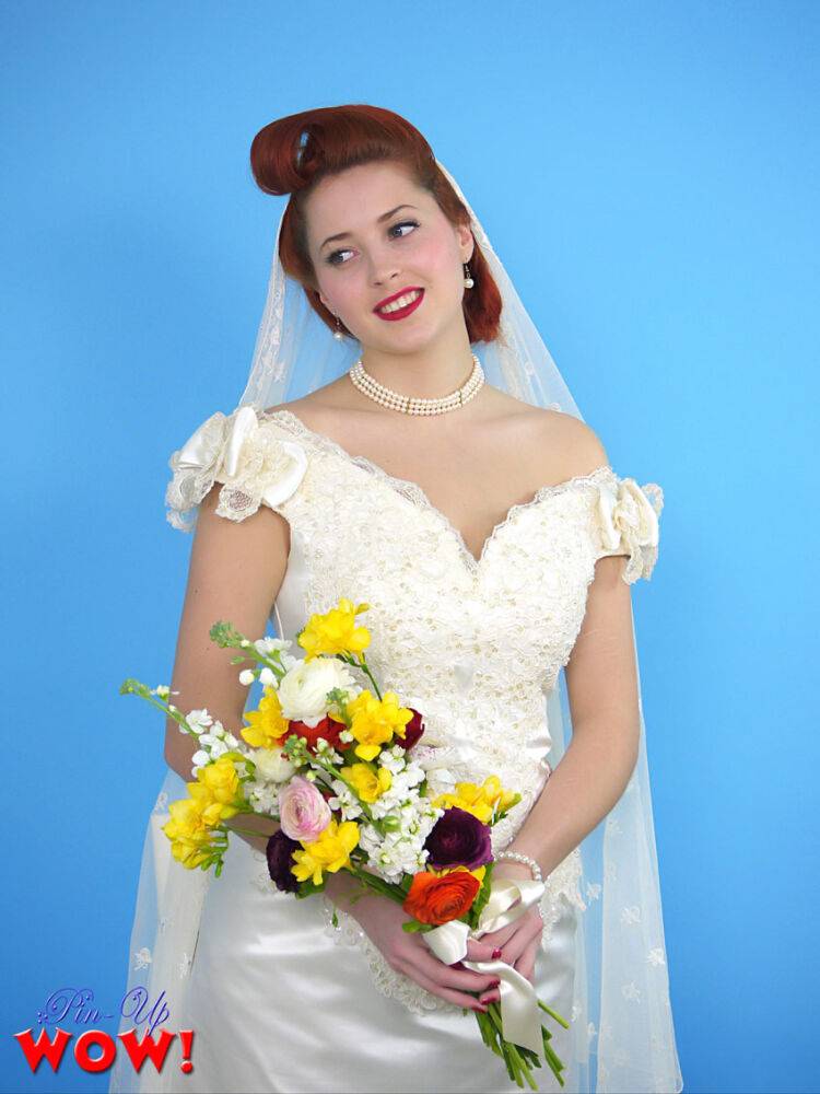 Natural redhead Lucy V slips off her wedding dress to bare big natural tits | Photo: 2914906