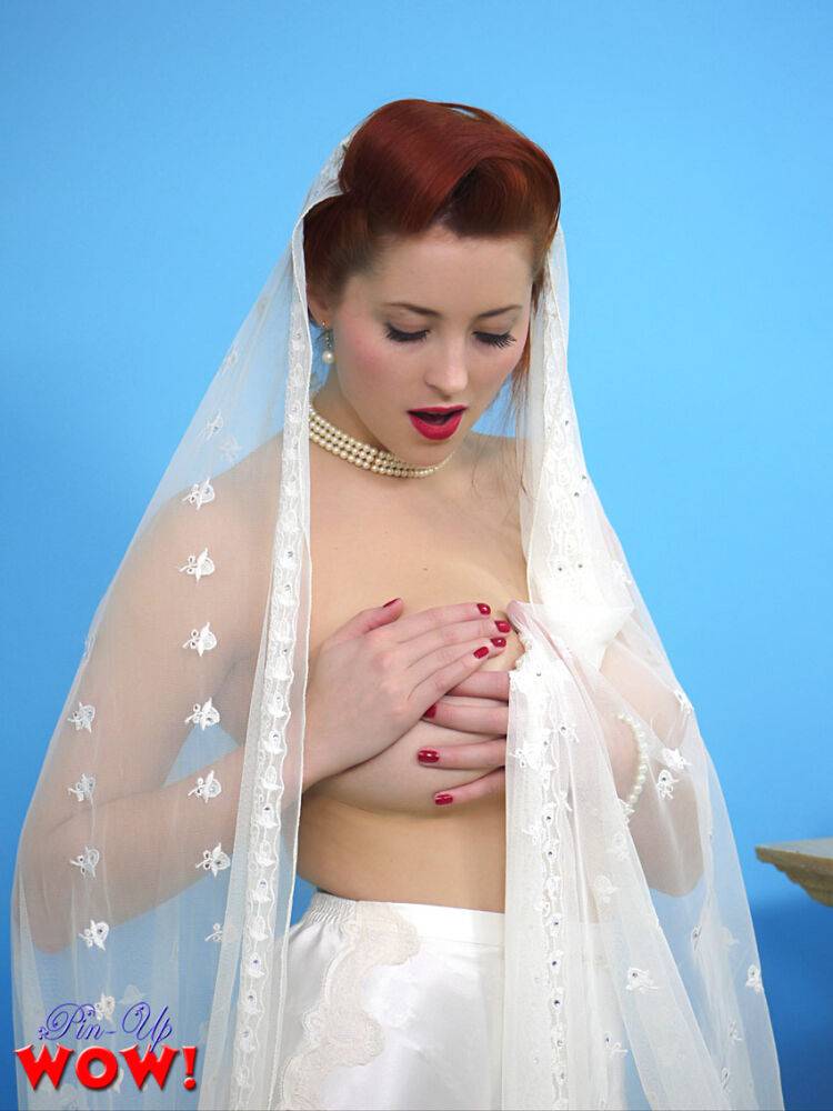 Natural redhead Lucy V slips off her wedding dress to bare big natural tits | Photo: 2914940