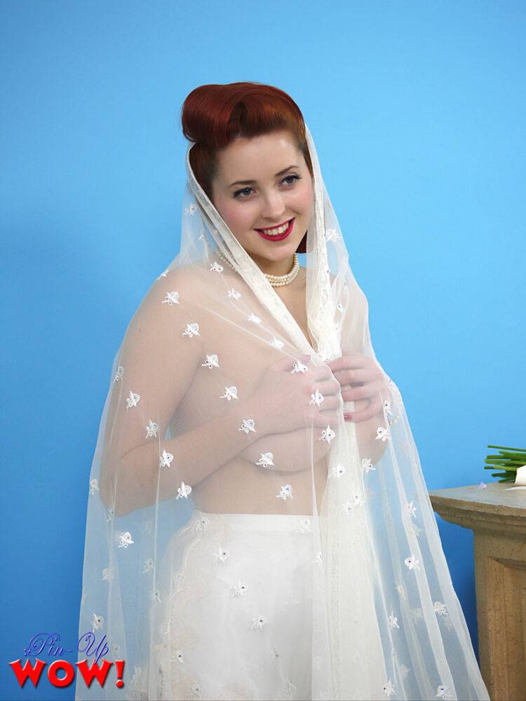 Natural redhead Lucy V slips off her wedding dress to bare big natural tits | Photo: 2914890